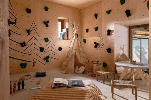 Cozy children's playroom with climbing wall and teepee tent