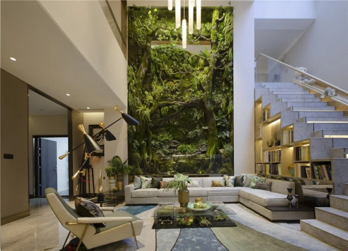 Modern living room with tall indoor vertical garden wall