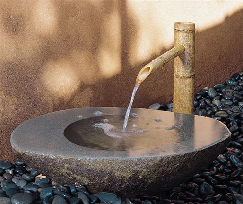 Stone water basin with bamboo spout