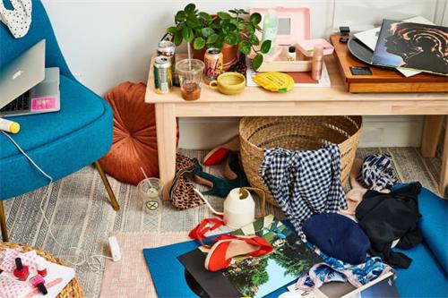 Disorganized desk area with scattered personal items